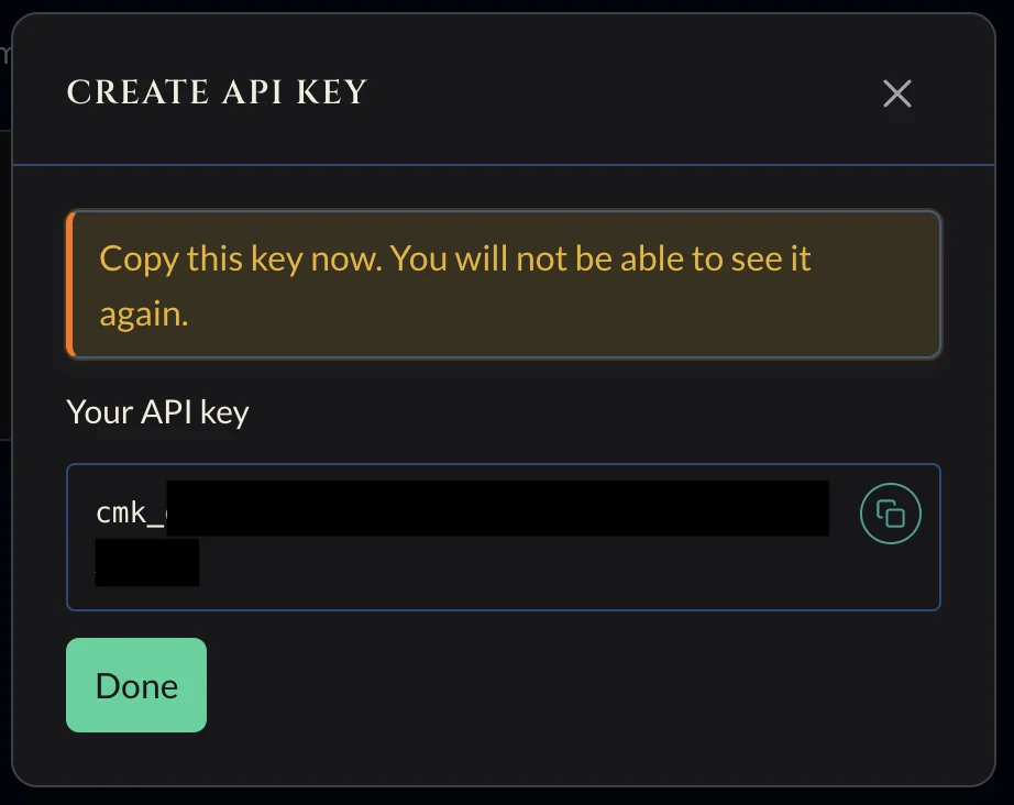 إنشاء حوار مفتاح API يعرض مفتاح cmk_ المُنشأ مع زر نسخ وتحذير بعدم ظهوره مرة أخرى.